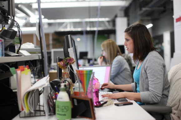 Facebook employees work in the design studio at the company's headquarters in Menlo Park, California.