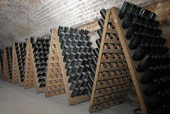 Bottles of champagne are stacked in the Maison Moet et Chandon underground galleries in Epernay, France.