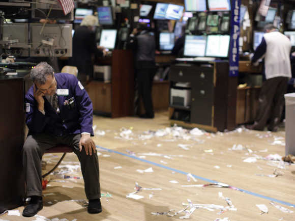 A trader reacts on the floor of the New York Stock Exchange.