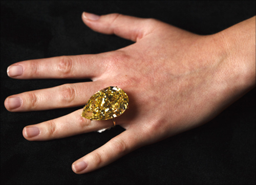 A model displays the Sun-Drop diamond during a media preview in Geneva.