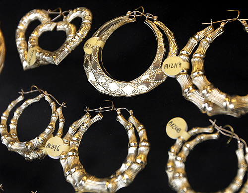Gold earrings are seen on display at a store in New York.