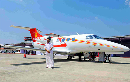 Kalyanaraman in front of the Embraer jet.