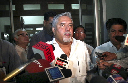 Kingfisher Airlines Chairman Vijay Mallya speaks with the media after his meeting with Director General of Civil Aviation E.K. Bharat Bhushan in New Delhi