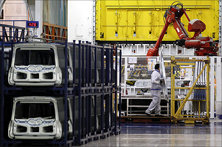 An employee of Fiat works on the new Panda car at the Fiat plant in Pomigliano D'Arco, near Naples.