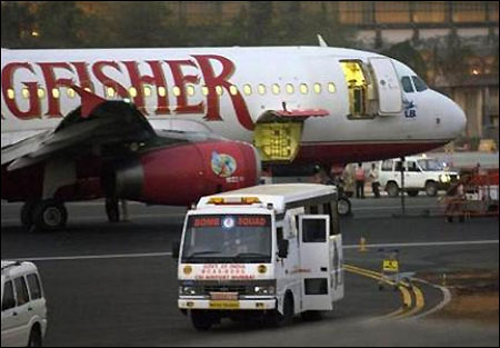 A bomb squad vehicle stands next to a Kingfisher flight at Chattrapati Shivaji airport in Mumbai.
