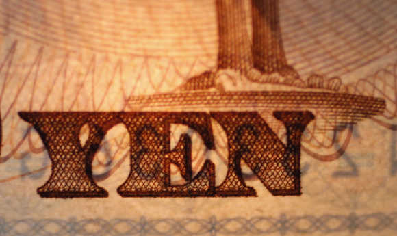 The word Yen is pictured on a Japanese banknote in Tokyo.