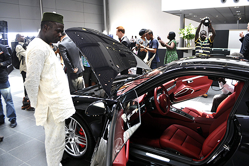 A Nigerian man looks at a vehicle by German carmaker Porsche in Lagos.