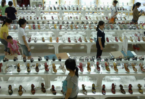 Customers look for shoes at a market in Hefei, east China's Anhui province.