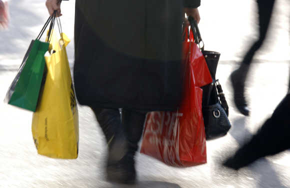 A woman carries shopping bags in Strasbourg, France.