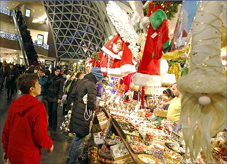 Christmas shoppers walk through Zlote Tarasy Shopping Mall in Warsaw.