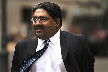 Billionaire Galleon Group hedge fund co-founder Raj Rajaratnam enters a Manhattan Federal Court.