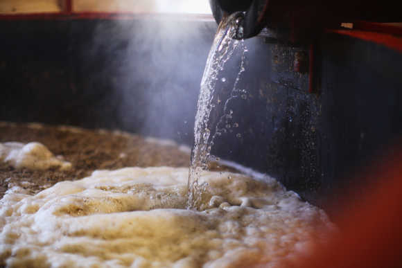 Water is pumped into the Mash Tun at Edradour distillery.