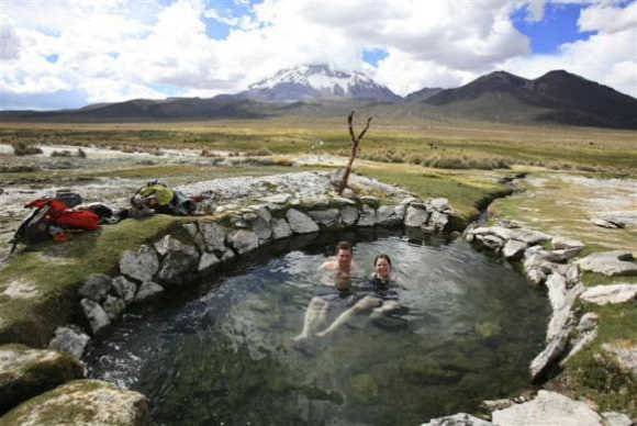 Newlyweds Bart Swaan, left, and Greet Oostvogels, right, from Belgium, take a bath in a hotspring in the Sajama national park, one of 22 natural reserves in Bolivia, located some 250km southwest of La Paz, Bolivia.