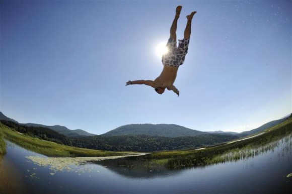 A boy jumps into Lake Cerknica in Slovenia.
