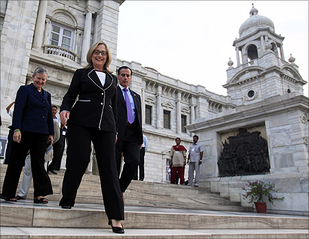 US Secretary of State Hillary Clinton (2nd L) walks down the steps of Victoria Memorial Hall in Kolkata.