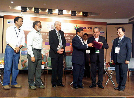 Dr Jagdish Sheth (3rd from right, receives a momento from Dr. H. Chaturvedi, Director BIMTEC.