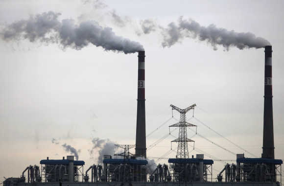 Smoke billows from chimneys of a coal-burning power plant in Wuhan, China.