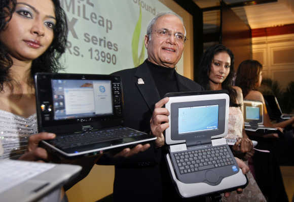 Ajai Chowdhry, Chairman and CEO, HCL Infosystems, displays HCL Mileap Y series laptop in a file photo.
