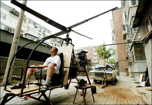 A self-styled Chinese inventor tests his homemade helicopter next to his apartment in Beijing.