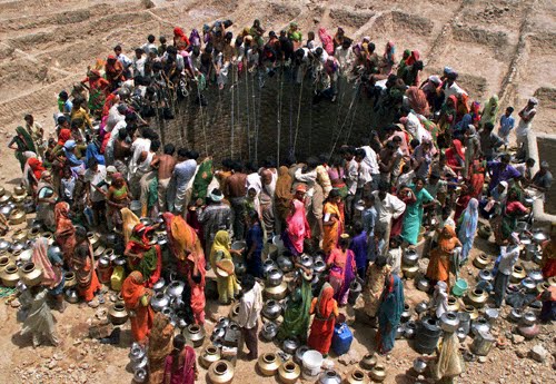 Parched villagers mob a village well in Natwargadh, Gujarat.