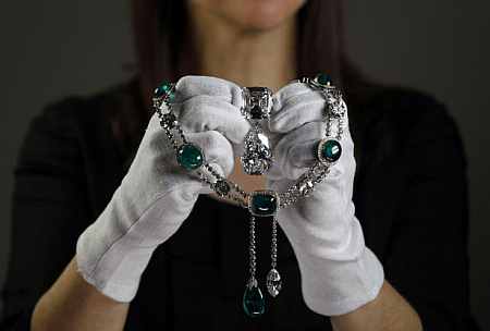 Curator Caroline de Guitaut poses with the Cullinan VII necklace at the Queen's Gallery in Buckingham Palace in London