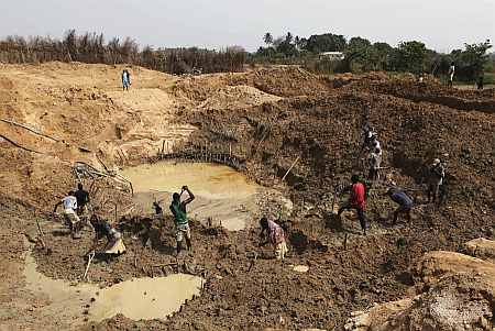 Artisanal diamond miners work at Tumbodu, north of the town of Koidu in eastern Sierra Leone