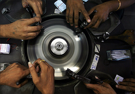 Employees work at a diamond factory in Surat