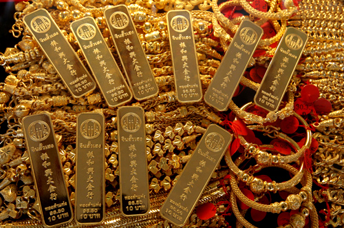 Gold bars and jewellery are displayed in a shop in Bangkok's Chinatown.