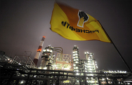 Flag with the logo of Rosneft, Russia's largest oil company, flutters over the Novokuibyshevsk refinery near the city of Samara.