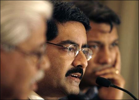 Kumar Mangalam Birla (C) speaks during a news conference in Mumbai.