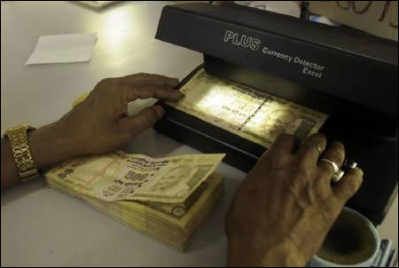 Why the rupee is likely to hit 60/UD$