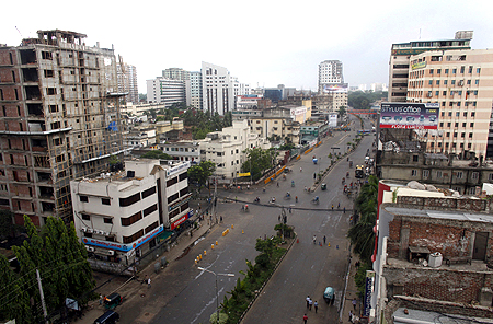 A usually busy Dhaka street is empty during a strike.
