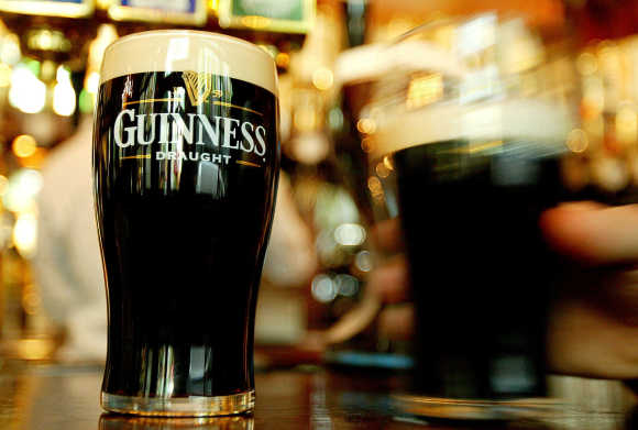 A view of pints of Guinness in a London pub.