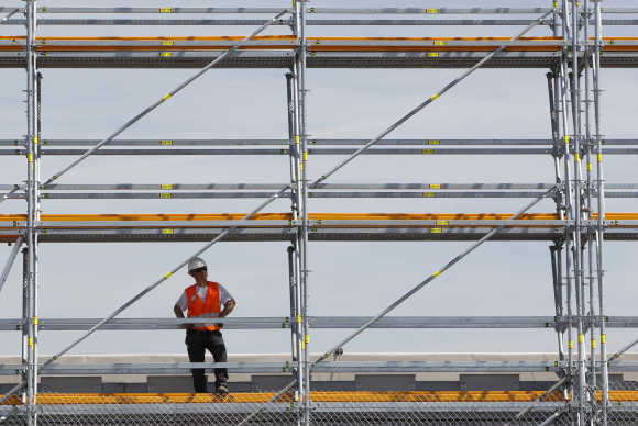 A worker takes a break while working at a construction area at Munich's airport.
