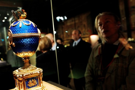 A visitor looks at 'The Kelch Chanticleer Egg' on display at the exhibition 'Faberge. The Sacred Images' , in the Vatican Museums at the Vatican.