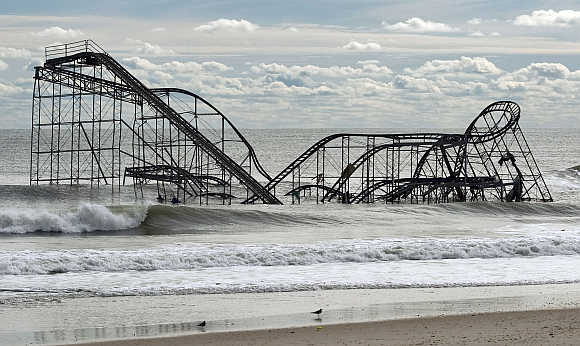 The remnants of a roller coast sits in the surf three days after Hurricane Sandy came ashore in Seaside Heights, New Jersey.