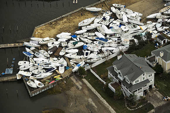 Boats are seen in a yard, where they washed onto shore during Hurricane Sandy, near Monmouth Beach, New Jersey.