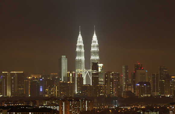 The Petronas Twin Towers in Kuala Lumpur after lights were turned on after the Earth Hour.