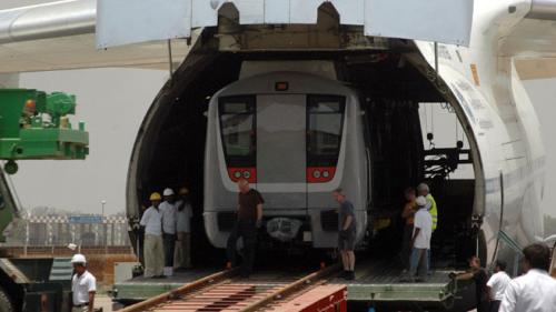 A Delhi-metro rail carriage is loaded into a cargo aircraft. The award-winning project has transformed the public transport system in the capital