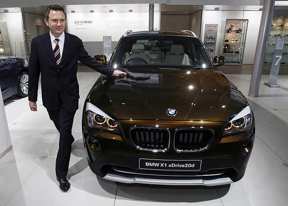 Peter Kronschnabl, President of BMW India, with BMW X1 xDrive20d in New Delhi.