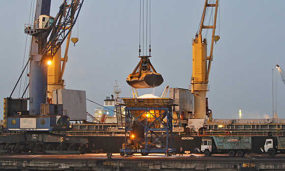 A crane unloads fertiliser from a cargo ship at Mundra Port in Gujarat.