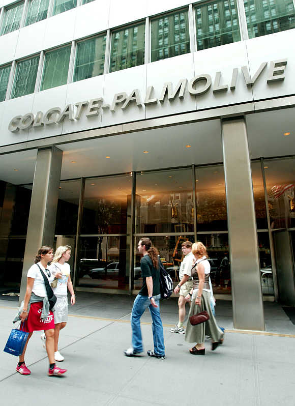 People pass the entrance of Colgate-Palmolive World Headquaters in New York City.