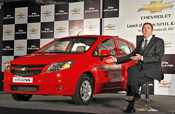 Lowell Paddock, President and Managing Director, General Motors India, with Chevrolet Sail U-VA car in New Delhi.