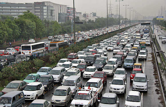 Traffic moves along as it rains in Gurgaon.