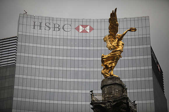 The Angel of Independence monument stands in front of HSBC's headquarters in Mexico City.