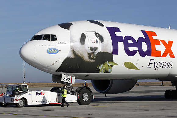 FedEx Panda Express aircraft carrying two giant pandas taxis along the runway at the Charles-de-Gaulle airport near Paris.