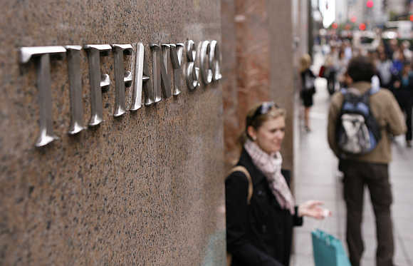 A woman walks out of the Tiffany & Co store on Fifth Avenue in New York.