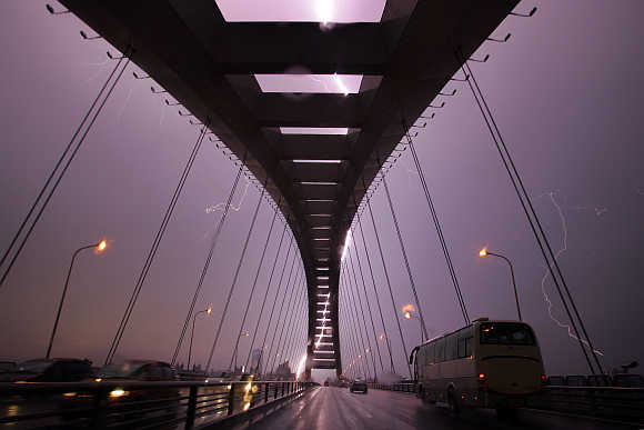 A lightning bolt illuminates the sky above Lupu Bridge in Shanghai.