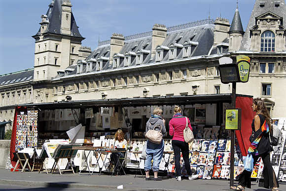 View of Paris' antique booksellers or bouquinistes along the banks of the river Seine.
