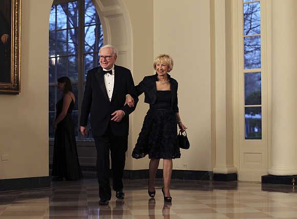 Warren Buffett with his wife Astrid Menks at the White House in Washington, DC.